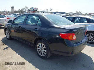 2009 Toyota Corolla with VIN 1NXBU40E89Z056754, listed as a IAAI auction lot 41989594 with 187,890 mi miles. Bid and sale history available at carsss.com. Image 3.