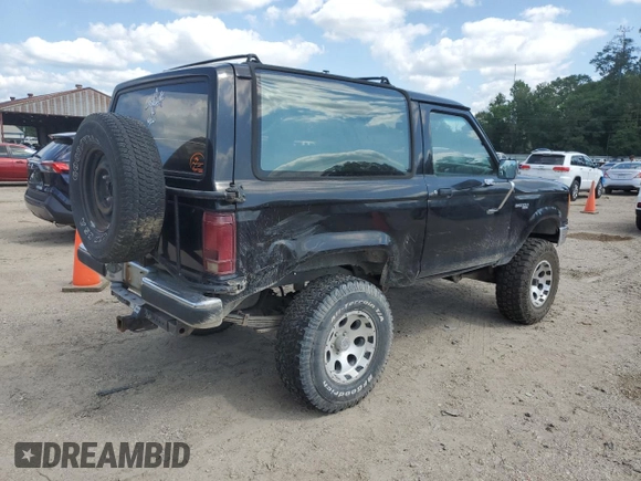 1990 Ford Bronco with VIN 1FMCU14T9LUA15536, listed as a Copart auction lot 54391815 with 319,124 mi miles and Salvage title. Bid and sale history available at DreamBid. Image 3.