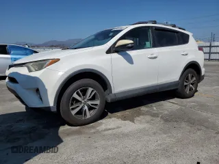 2018 Toyota RAV4 XLE with VIN 2T3WFREV6JW427410, listed as a Copart auction lot 62781965 with 157,800 mi miles and Salvage title. Bid and sale history available at DreamBid. Image 1.