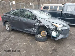 2018 Toyota Prius Two z VIN JTDKBRFU7J3065008, wystawiony jako IAAI lot #41744883 z przebiegiem 94 031 mil mil oraz . Historia ofert i sprzedaży dostępna na DreamBid. Obrazek 1.