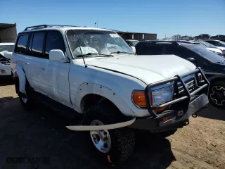 1997 Toyota Land Cruiser with VIN JT3HJ85J2V0180979, listed as a Copart auction lot 73216714 with 239,444 mi miles and Salvage Title. Bid and sale history available at carsss.com. Image 4.