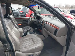 1999 Jeep Grand Cherokee Limited with VIN 1J4GW68N7XC739479, listed as a IAAI auction lot 41448323 with 129,840 mi miles. Bid and sale history available at carsss.com. Image 5.