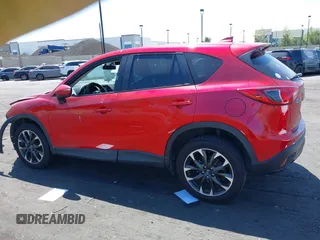 2016 Mazda CX-5 Grand Touring z VIN JM3KE2DY2G0660385, wystawiony jako IAAI lot #42101004 z przebiegiem 166 336 mil mil oraz . Historia ofert i sprzedaży dostępna na DreamBid. Obrazek 15.
