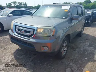 2009 Honda Pilot EX-L with VIN 5FNYF48569B050795, listed as a IAAI auction lot 42149732 with 281,504 mi miles. Bid and sale history available at carsss.com. Image 2.