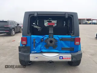 2014 Jeep Wrangler Arctic z VIN 1C4GJWBG3EL313350, wystawiony jako IAAI lot #41442520 z przebiegiem Nie podano mil oraz . Historia ofert i sprzedaży dostępna na DreamBid. Obrazek 16.