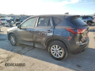 2015 Mazda CX-5 Touring with VIN JM3KE2CY0F0439125, listed as a Copart auction lot 43324945 with 210,404 mi miles and Clean Title. Bid and sale history available at DreamBid. Image 2.