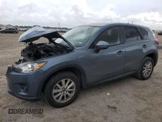 2016 Mazda CX-5 Touring z VIN JM3KE2CY8G0753493, wystawiony jako Copart lot #55056545 z przebiegiem 142 584 mil mil oraz Szkody całkowita. Historia ofert i sprzedaży dostępna na DreamBid. Obrazek 1.