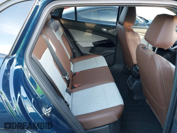 2023 Volkswagen ID.4 Pro z VIN 1V2DNPE81PC017620, wystawiony jako IAAI lot #41573053 z przebiegiem 15 462 mil mil oraz . Historia ofert i sprzedaży dostępna na DreamBid. Obrazek 8.