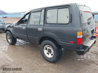 1996 Toyota Land Cruiser with VIN JT3HJ85J4T0115628, listed as a IAAI auction lot 41191476 with 210,005 mi miles. Bid and sale history available at carsss.com. Image 3.