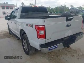 2019 Ford F-150 XL with VIN 1FTEW1E50KFA47687, listed as a IAAI auction lot 42021043 with 129,337 mi miles. Bid and sale history available at carsss.com. Image 3.
