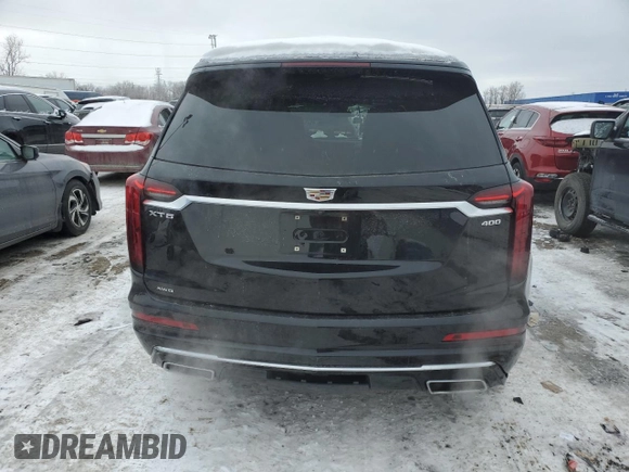 2021 Cadillac XT6 Premium Luxury with VIN 1GYKPDRS3MZ165049, listed as a Copart auction lot 45456145 with 57,112 mi miles and Salvage title. Bid and sale history available at DreamBid. Image 6.