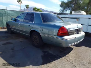2006 Mercury Grand Marquis GS with VIN 2MEFM74V16X650056, listed as a IAAI auction lot 42107815 with 156,710 mi miles. Bid and sale history available at carsss.com. Image 3.