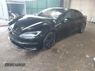 2022 Tesla Model S Plaid with VIN 5YJSA1E64NF477855, listed as a IAAI auction lot 41470591 with Not provided miles and . Bid and sale history available at DreamBid. Image 2.