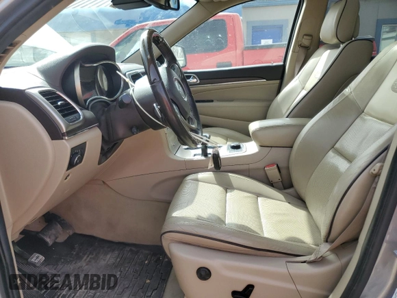 2014 Jeep Grand Cherokee Overland with VIN 1C4RJFCG4EC326325, listed as a Copart auction lot 49166645 with 128,261 mi miles and Salvage Title. Bid and sale history available at DreamBid. Image 7.