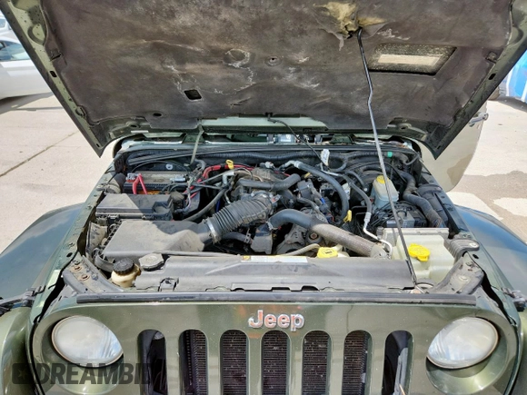 2008 Jeep Wrangler Unlimited Sahara with VIN 1J4GA59148L608970, listed as a Copart auction lot 64433495 with 134,055 mi miles and Salvage title. Bid and sale history available at DreamBid. Image 12.