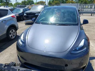 2023 Tesla Model Y Long Range with VIN 7SAYGDEE5PF882582, listed as a IAAI auction lot 42059015 with 10,567 mi miles and . Bid and sale history available at carsss.com. Image 12.