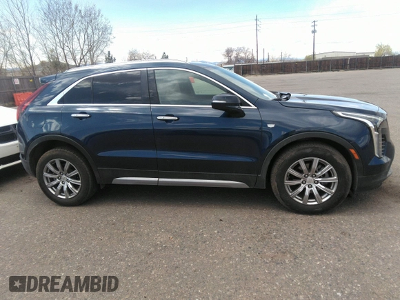 2021 Cadillac XT4 FWD Premium Luxury with VIN 1GYFZCR48MF004009, listed as a IAAI auction lot 41956723 with 82,483 mi miles. Bid and sale history available at carsss.com. Image 13.