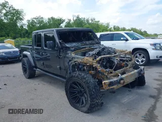 2021 Jeep Gladiator 80th Anniversary z VIN 1C6HJTAG4ML549497, wystawiony jako IAAI lot #42128741 z przebiegiem Nie podano mil oraz . Historia ofert i sprzedaży dostępna na DreamBid. Obrazek 1.