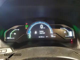 2018 Honda Clarity z VIN JHMZC5F16JC013751, wystawiony jako Copart lot #56651145 z przebiegiem 61 385 mil mil oraz Szkoda całkowita • Salvage title. Historia ofert i sprzedaży dostępna na DreamBid. Obrazek 9.