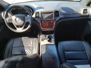 2014 Jeep Grand Cherokee Laredo with VIN 1C4RJEAGXEC217249, listed as a Copart auction lot 48585195 with 131,635 mi miles and Salvage Title. Bid and sale history available at DreamBid. Image 8.