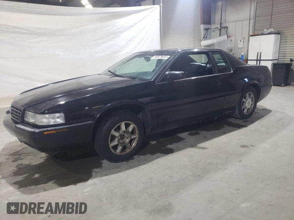 2000 Cadillac Eldorado Touring ETC z VIN 1G6ET1294YU144883, wystawiony jako Copart lot #80979854 z przebiegiem 89 271 mil mil oraz Czysty tytuł • Clean title. Historia ofert i sprzedaży dostępna na DreamBid. Obrazek 1.