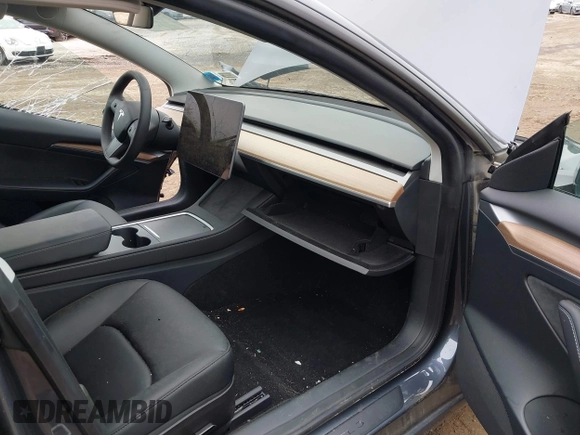 2023 Tesla Model 3 with VIN 5YJ3E1EA9PF673399, listed as a IAAI auction lot 42392643 with 7,571 mi miles and . Bid and sale history available at DreamBid. Image 5.