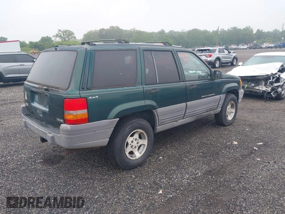1996 Jeep Grand Cherokee Laredo with VIN 1J4GZ58S6TC333856, listed as a IAAI auction lot 42504895 with 176,955 mi miles and . Bid and sale history available at DreamBid. Image 4.