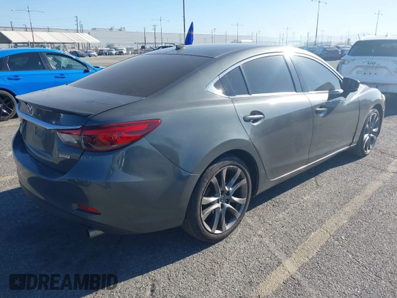 2017 Mazda 6 Grand Touring with VIN JM1GL1W51H1137470, listed as a IAAI auction lot 41872756 with 132,564 mi miles. Bid and sale history available at carsss.com. Image 4.