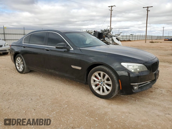 2015 BMW 7 Series 740Li xDrive with VIN WBAYF4C50FGS99289, listed as a Copart auction lot 79809474 with 128,993 mi miles and Salvage Title. Bid and sale history available at carsss.com. Image 4.