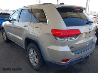 2014 Jeep Grand Cherokee Laredo with VIN 1C4RJFAG7EC380544, listed as a IAAI auction lot 42021130 with 166,589 mi miles. Bid and sale history available at carsss.com. Image 3.