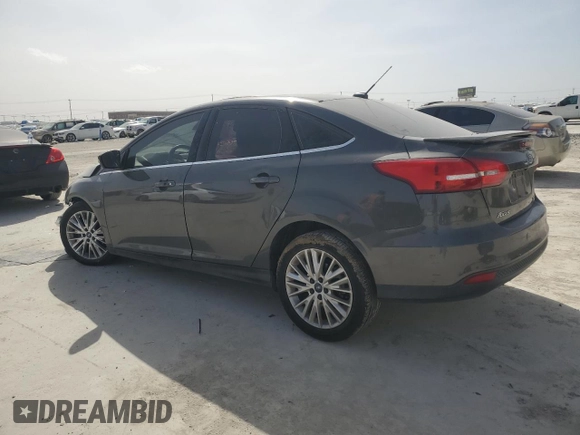 2016 Ford Focus Titanium with VIN 1FADP3J20GL274263, listed as a Copart auction lot 48340175 with 114,941 mi miles and Salvage title. Bid and sale history available at DreamBid. Image 2.