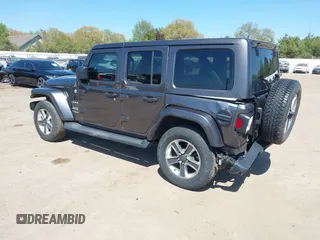 2018 Jeep Wrangler Unlimited Sahara with VIN 1C4HJXEG0JW166645, listed as a IAAI auction lot 42228492 with 58,416 mi miles and . Bid and sale history available at DreamBid. Image 3.