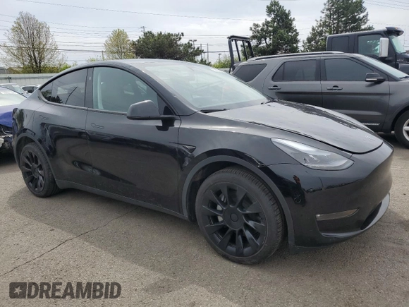 2023 Tesla Model Y Long Range z VIN 7SAYGDEE0PF869710, wystawiony jako Copart lot #52885365 z przebiegiem 13 919 mil mil oraz Szkoda całkowita • Salvage title. Historia ofert i sprzedaży dostępna na DreamBid. Obrazek 4.