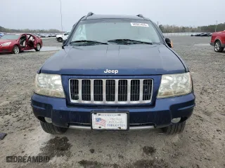 2004 Jeep Grand Cherokee Laredo with VIN 1J4GX48S64C165105, listed as a Copart auction lot 50301455 with 299,686 mi miles and Salvage Title. Bid and sale history available at carsss.com. Image 5.