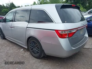 2011 Honda Odyssey Touring with VIN 5FNRL5H93BB071518, listed as a IAAI auction lot 42402421 with 227,647 mi miles and . Bid and sale history available at DreamBid. Image 3.