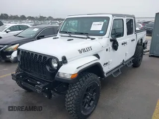 2021 Jeep Gladiator Willys with VIN 1C6HJTAG1ML575474, listed as a IAAI auction lot 41439898 with 44,335 mi miles and . Bid and sale history available at DreamBid. Image 19.