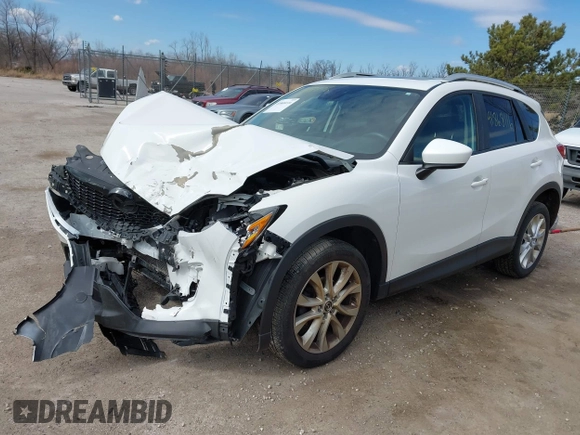 2014 Mazda CX-5 Grand Touring with VIN JM3KE4DY8E0397330, listed as a IAAI auction lot 41868116 with 180,891 mi miles. Bid and sale history available at carsss.com. Image 2.