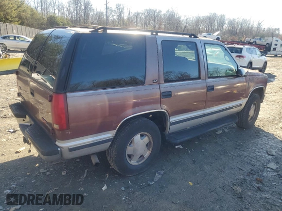 1997 GMC Yukon with VIN 1GKEK13R1VJ702558, listed as a Copart auction lot 85930054 with 165,837 mi miles and Salvage Title. Bid and sale history available at carsss.com. Image 3.