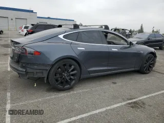 2014 Tesla Model S 60 with VIN 5YJSA1S14EFP56277, listed as a Copart auction lot 57162685 with Not provided miles and Salvage title. Bid and sale history available at DreamBid. Image 3.