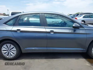 2019 Volkswagen Jetta S z VIN 3VWC57BU0KM223143, wystawiony jako IAAI lot #42605872 z przebiegiem 144 245 mil mil oraz . Historia ofert i sprzedaży dostępna na DreamBid. Obrazek 14.