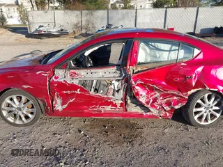 2015 Mazda 3 S Grand Touring z VIN JM1BM1W36F1244730, wystawiony jako IAAI lot #41722861 z przebiegiem 123 731 mil mil oraz . Historia ofert i sprzedaży dostępna na DreamBid. Obrazek 6.