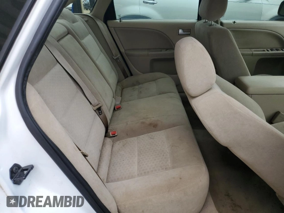 2005 Ford Five Hundred SE z VIN 1FAFP23155G171840, wystawiony jako Copart lot #54190685 z przebiegiem 147 383 mil mil oraz Szkoda całkowita • Salvage title. Historia ofert i sprzedaży dostępna na DreamBid. Obrazek 10.
