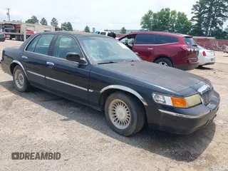 2002 Mercury Grand Marquis LS Premium z VIN 2MEFM75W52X611200, wystawiony jako IAAI lot #42384389 z przebiegiem 184 035 mil mil oraz . Historia ofert i sprzedaży dostępna na DreamBid. Obrazek 1.