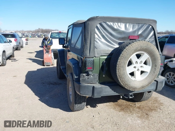 2007 Jeep Wrangler X with VIN 1J8FA24197L205095, listed as a IAAI auction lot 41388452 with 127,051 mi miles and . Bid and sale history available at carsss.com. Image 3.