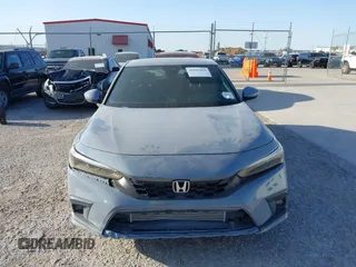 2022 Honda Civic Sport Touring z VIN 19XFL1G89NE009751, wystawiony jako IAAI lot #41845803 z przebiegiem Nie podano mil oraz . Historia ofert i sprzedaży dostępna na DreamBid. Obrazek 11.