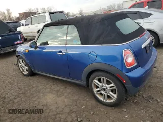 2014 MINI Convertible with VIN WMWZN3C53ET861225, listed as a Copart auction lot 87791665 with 104,151 mi miles and Salvage title. Bid and sale history available at DreamBid. Image 2.