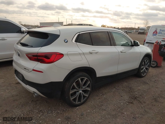 2020 BMW X2 sDrive28i with VIN WBXYH9C02L5R10335, listed as a IAAI auction lot 40651317 with 67,897 mi miles. Bid and sale history available at carsss.com. Image 4.