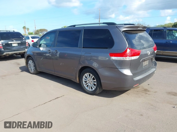 2014 Toyota Sienna XLE with VIN 5TDYK3DC2ES438980, listed as a IAAI auction lot 42067750 with 143,728 mi miles and . Bid and sale history available at DreamBid. Image 3.