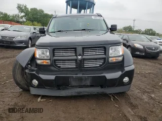 2011 Dodge Nitro Heat with VIN 1D4PT4GK7BW597557, listed as a Copart auction lot 58973335 with 180,958 mi miles and Salvage title. Bid and sale history available at DreamBid. Image 5.