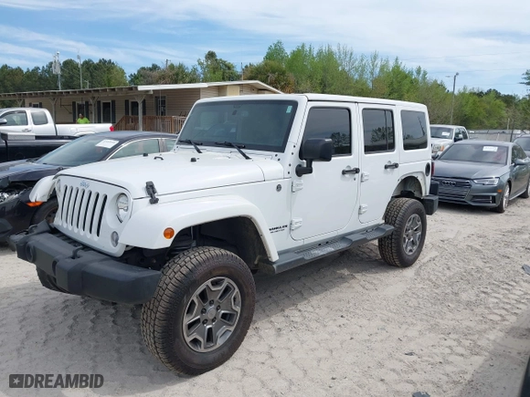 2015 Jeep Wrangler Unlimited Rubicon Hard Rock with VIN 1C4HJWFG7FL684057, listed as a IAAI auction lot 41963885 with 103,240 mi miles. Bid and sale history available at carsss.com. Image 2.